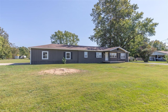 single story home with a front yard