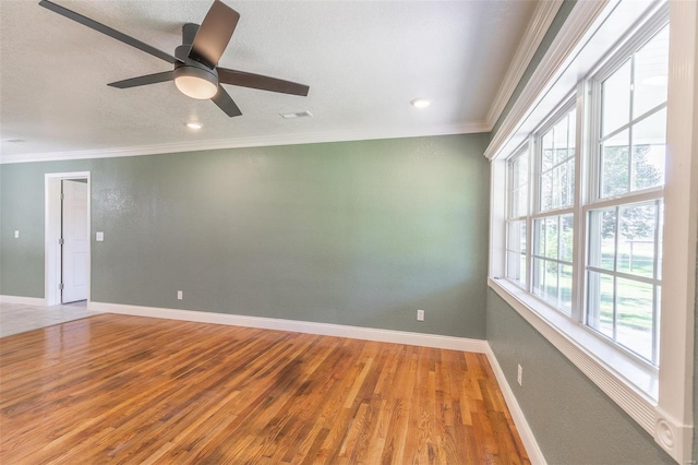 unfurnished room with ornamental molding, ceiling fan, hardwood / wood-style floors, and a textured ceiling