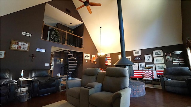 cinema featuring dark hardwood / wood-style floors, high vaulted ceiling, and ceiling fan