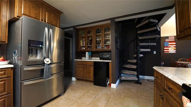 kitchen with light tile patterned floors and black appliances