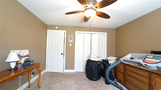 interior space featuring ceiling fan and light carpet