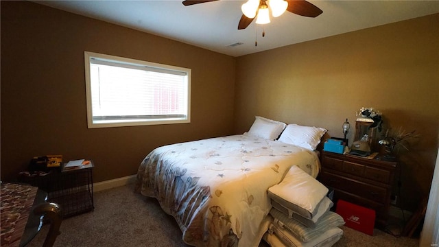 bedroom featuring ceiling fan and carpet