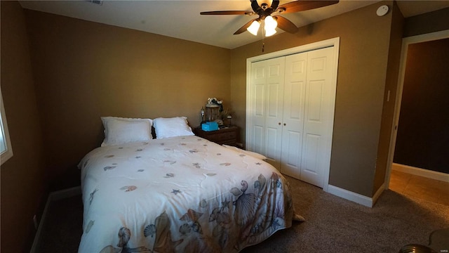 bedroom with ceiling fan, a closet, and carpet