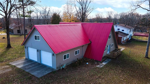 view of side of home featuring a lawn