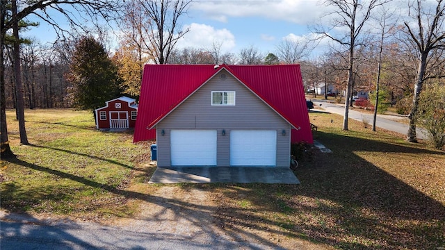 garage with a lawn