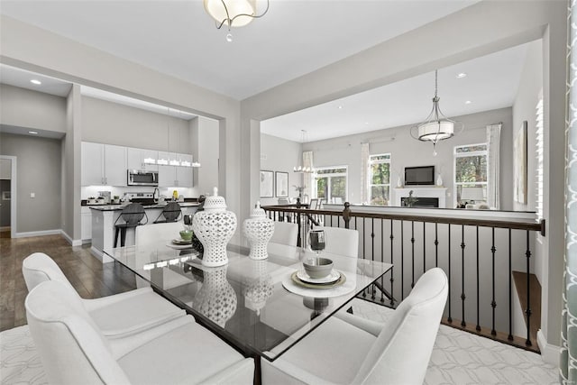 dining space featuring light wood-type flooring