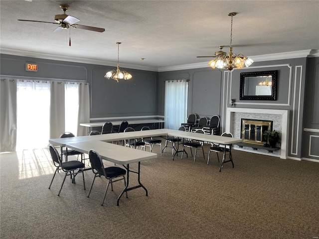 carpeted dining space with crown molding, ceiling fan, and a textured ceiling