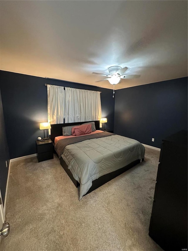 bedroom with ceiling fan and carpet floors