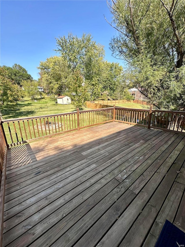 deck featuring a shed