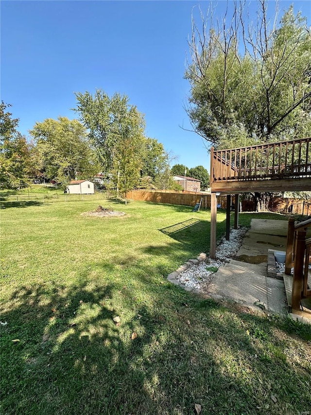 view of yard featuring a wooden deck