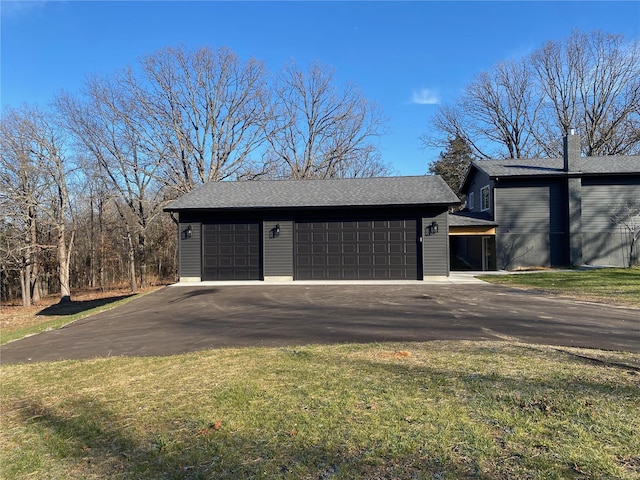 garage featuring a lawn