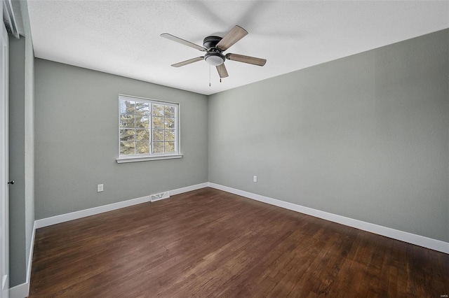 unfurnished room featuring ceiling fan and dark hardwood / wood-style floors