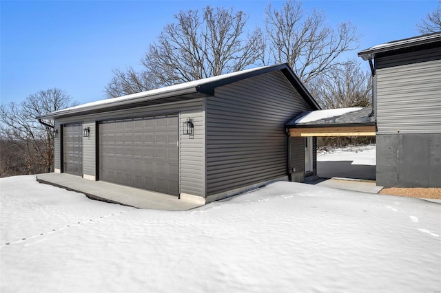 view of snow covered garage