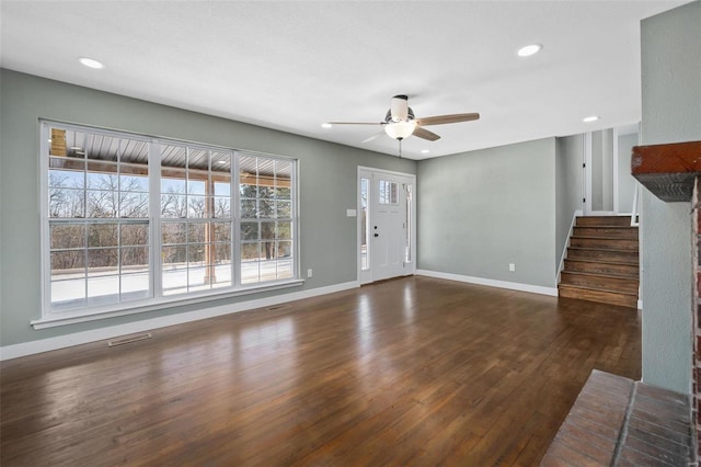 unfurnished living room featuring dark wood finished floors, recessed lighting, baseboards, and ceiling fan