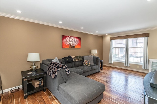 living room featuring hardwood / wood-style flooring and crown molding