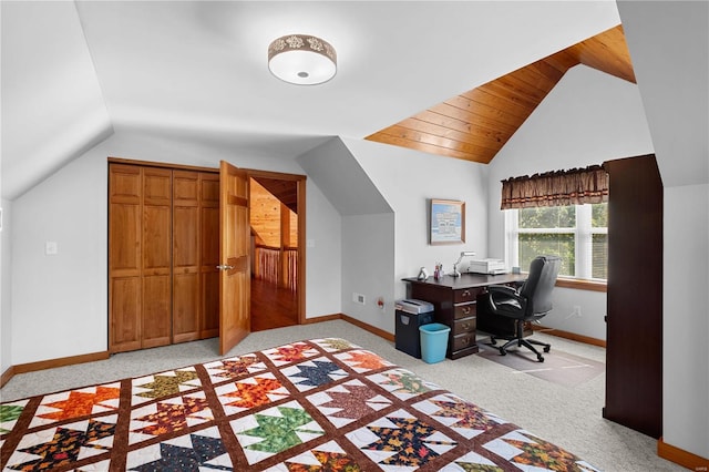 carpeted office with vaulted ceiling