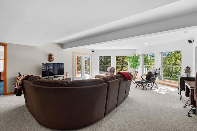 living room featuring french doors and light carpet