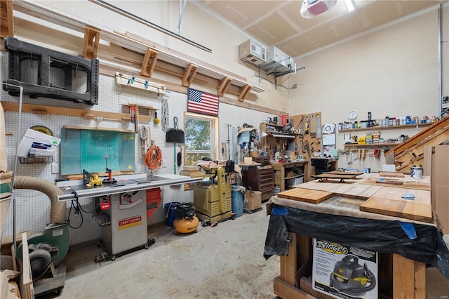 garage featuring a workshop area and a garage door opener