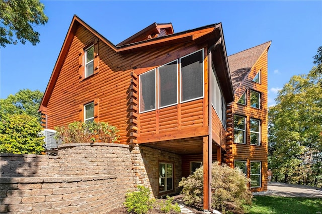 view of home's exterior featuring a sunroom