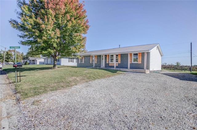 ranch-style home with a front lawn