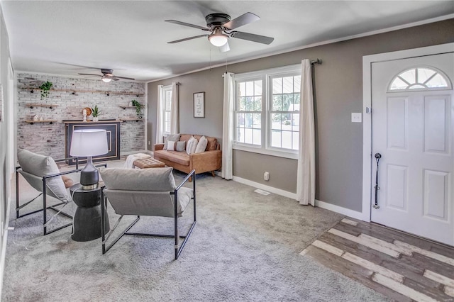 living room with hardwood / wood-style flooring, a wealth of natural light, and ceiling fan