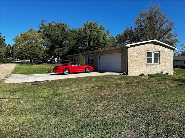 exterior space featuring an attached garage, driveway, brick siding, and a front yard