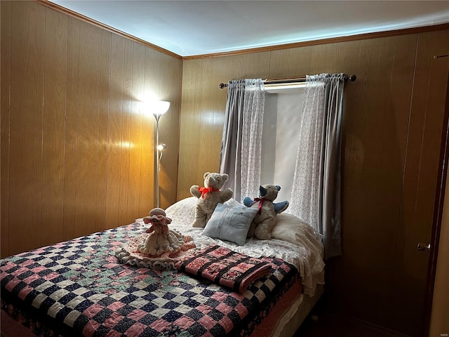 bedroom featuring wood walls