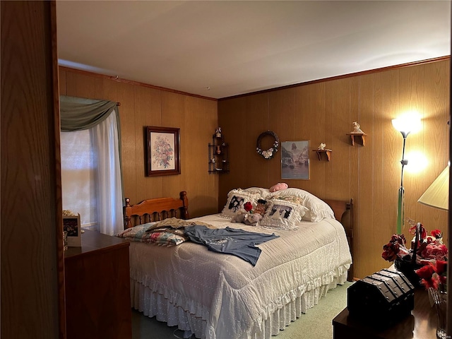 bedroom with carpet, crown molding, and wood walls