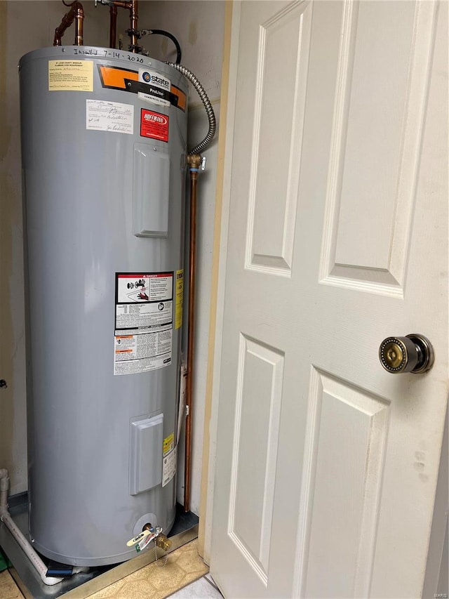 utility room with electric water heater