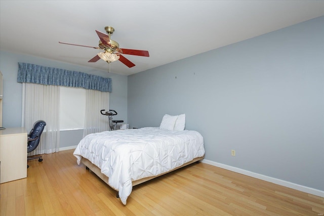 bedroom featuring hardwood / wood-style flooring and ceiling fan