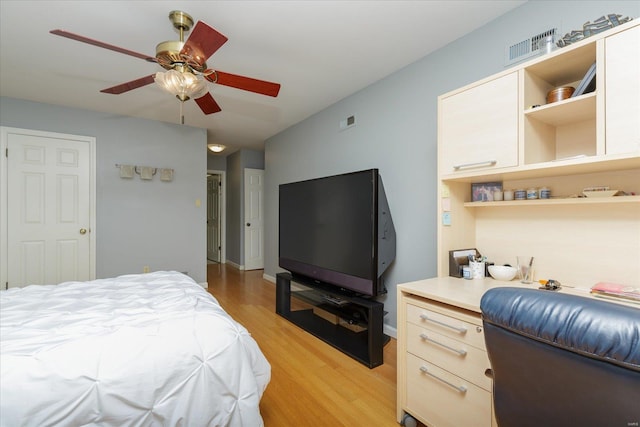 bedroom with ceiling fan and light hardwood / wood-style floors