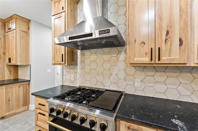 kitchen featuring decorative backsplash, light brown cabinetry, ventilation hood, and stainless steel range oven