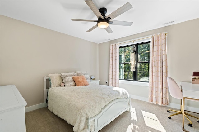 bedroom with ceiling fan and light colored carpet