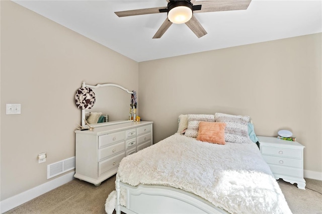 bedroom with light carpet and ceiling fan