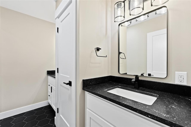 bathroom with tile patterned floors and vanity