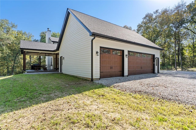 garage with a yard