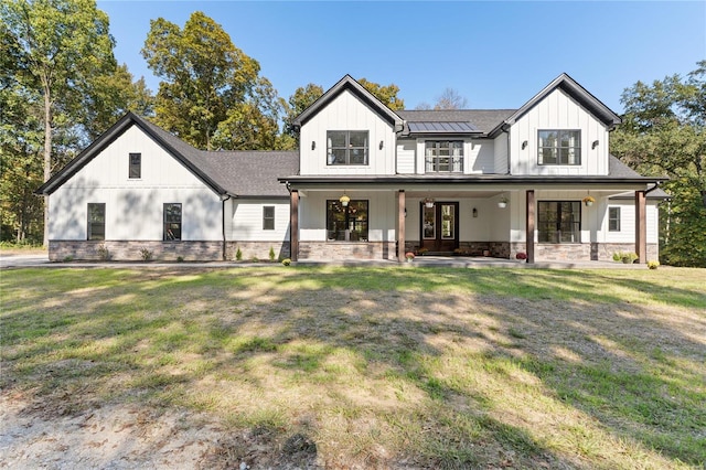 view of front of property with a front lawn and a porch