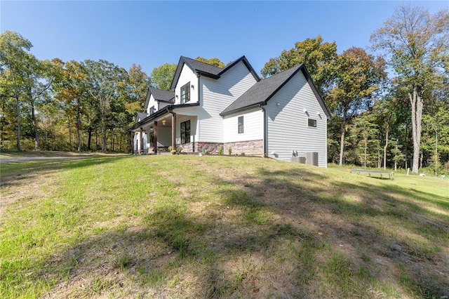 view of property exterior featuring a lawn