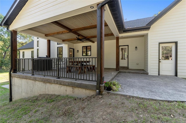 exterior space featuring ceiling fan