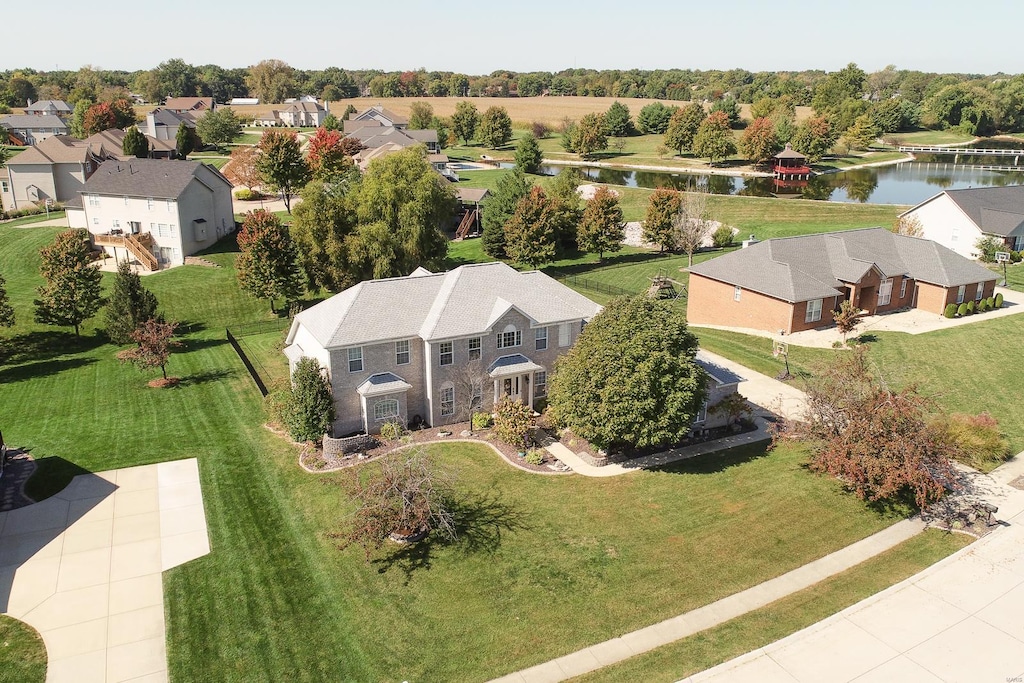 birds eye view of property with a water view