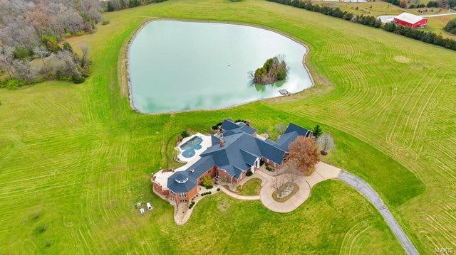 drone / aerial view featuring a rural view and a water view