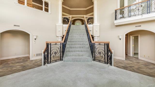 doorway to property featuring a balcony and a patio