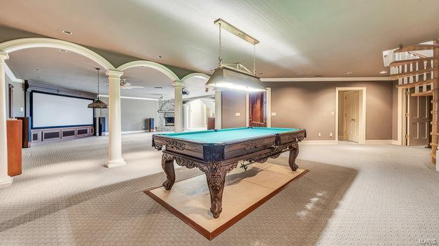 recreation room with light colored carpet, decorative columns, crown molding, and pool table