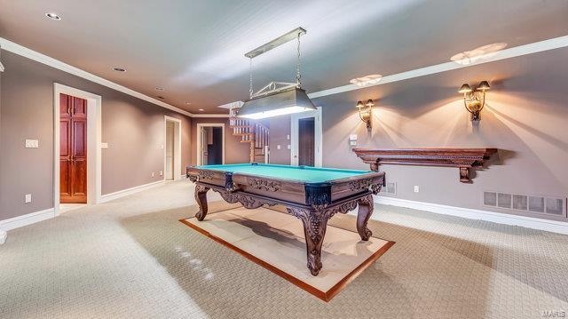 playroom featuring light colored carpet, crown molding, and pool table