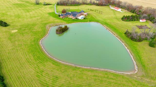 aerial view with a water view and a rural view