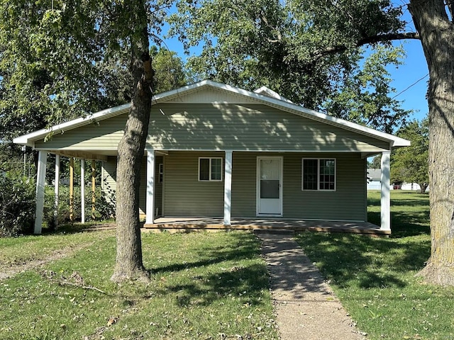 view of front of property with a front lawn and a porch