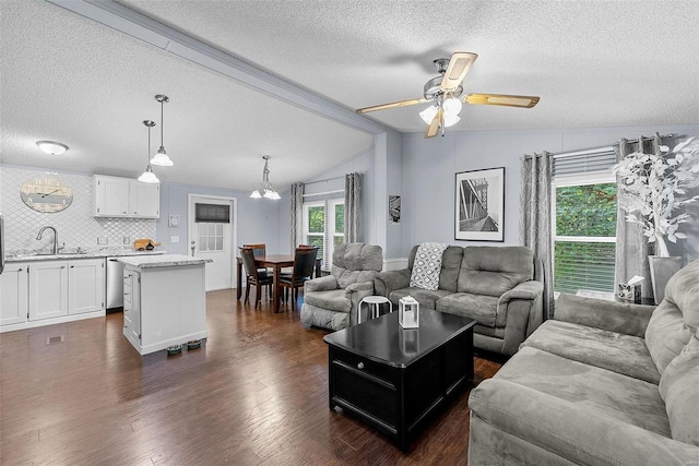 living room with a textured ceiling, lofted ceiling, ceiling fan with notable chandelier, and dark hardwood / wood-style flooring