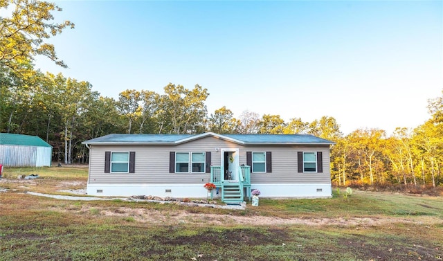 manufactured / mobile home with a storage shed