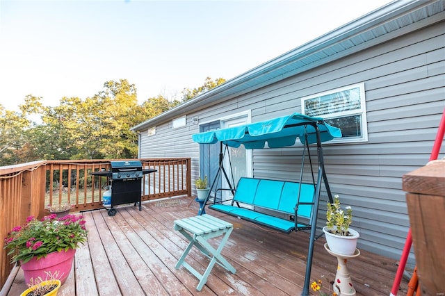 wooden deck featuring grilling area