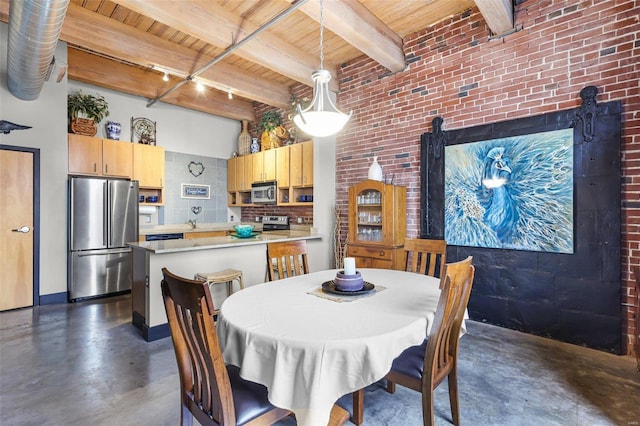 dining room with brick wall, beamed ceiling, a high ceiling, and wooden ceiling